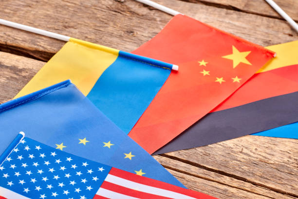 istock Close up flags collection on wooden table. 964223338