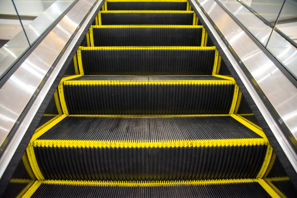 istock Electric escalator Way up the mall. 964223892