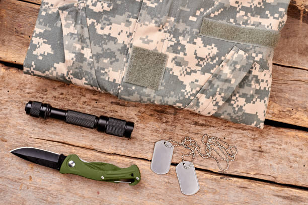 istock Military equipment on wooden background. 964226828