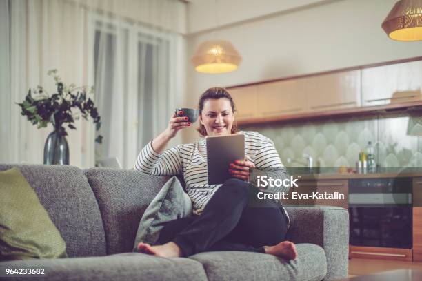 Young Woman At Home Stock Photo - Download Image Now - One Woman Only, Women, Overweight