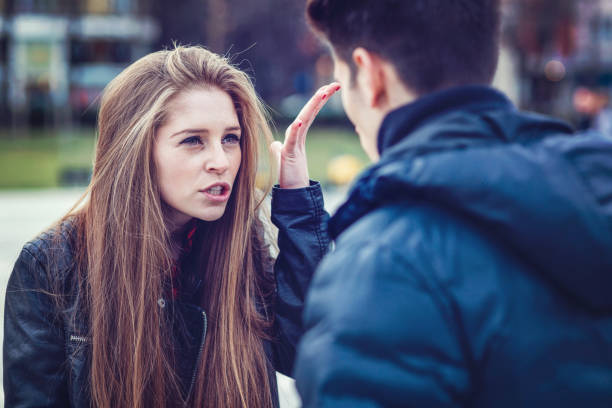 istock Angry blond woman talking and gesturing at her boyfriend 964233878