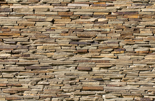 Dry stone wall texture background close up