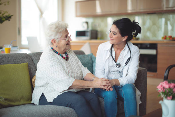 istock Social worker is visiting a senior woman 964237010