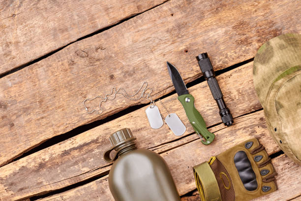 istock Military essentials items on wood. 964238182