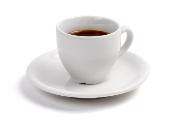 istock A cup of expresso coffee, in a white cup and saucer, on a white background with a drop shadow 964241508