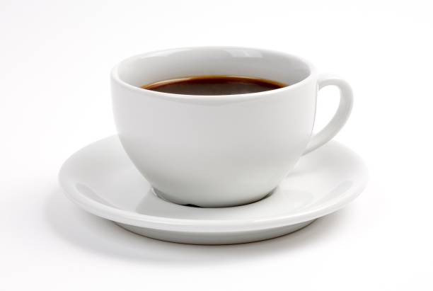 istock A cup of black coffee, in a white cup and saucer, on a white background with a drop shadow 964241526