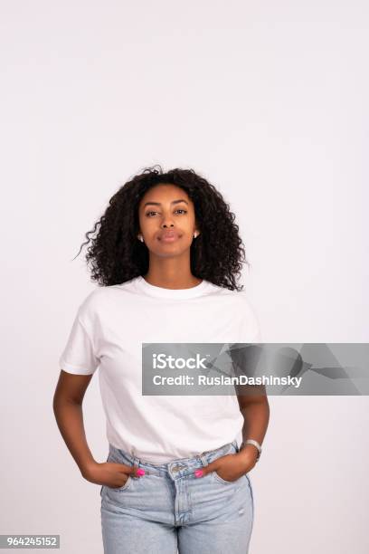 Woman Standing With Hands In The Pockets Stock Photo - Download Image Now - Women, T-Shirt, One Woman Only