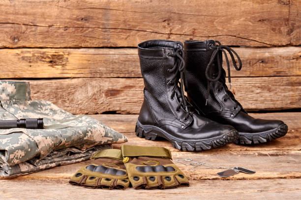 istock Military uniform set on wooden background. 964245722