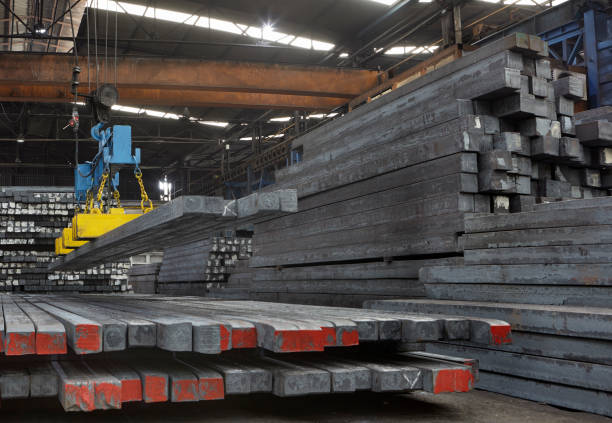 istock lifting with magnetic winch in iron and steel warehouse 964246250