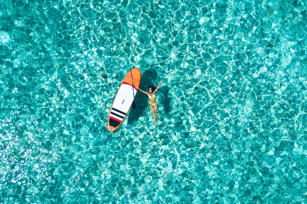 istock Woman on the paddleboard 964246598