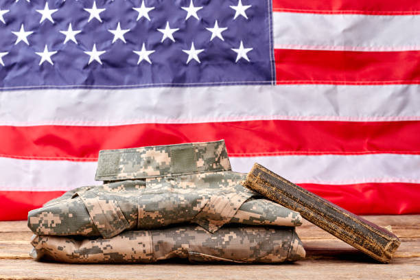 istock Soldier's diary and camouflage clothes. 964250462