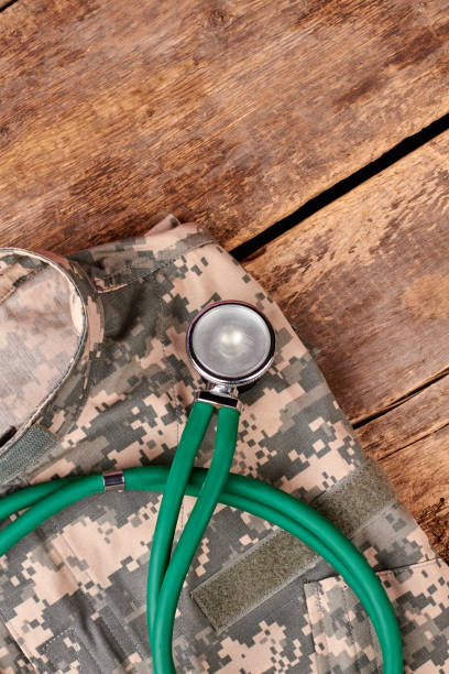 istock Military camouflage clothes and stethoscope. 964250900
