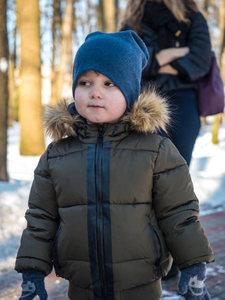 istock Cute little boy in winter clothes 964251142