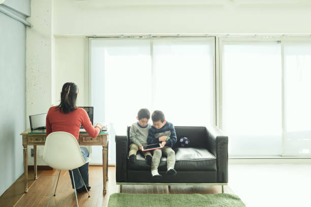 istock Mothers Working From Home with her two sons 964251398