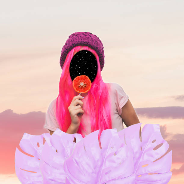 Girl with pink hair and space instead of a face holding an orange candy against the sky. Girl with pink hair and space instead of a face holding an orange candy against the sky. Contemporary art collage. Concept of memphis style posters. vaporwave photos stock pictures, royalty-free photos & images