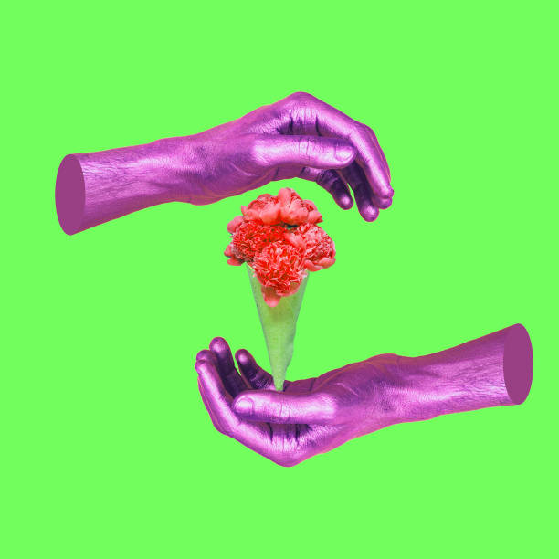 istock Painted in pink hands hold ice cream with flower. 964255172