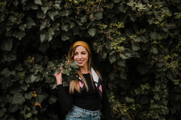 istock Young woman posing by plants 964255260