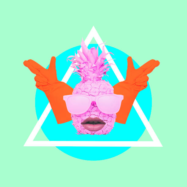 istock Pink pineapple in sunglasses and with lips showing by hands the gun gestures. 964255364