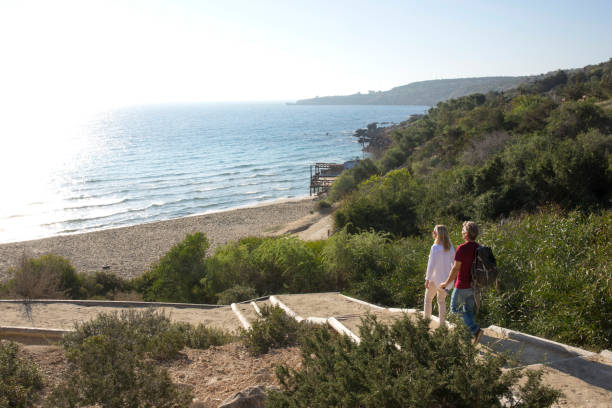 istock Couple explore Konnos Beach from walkway, Ayia Napa 964255872