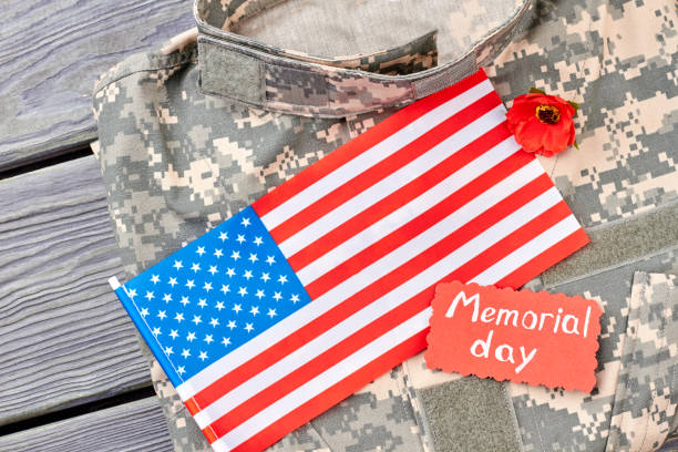 istock Military camouflage clothes and us flag. 964256668