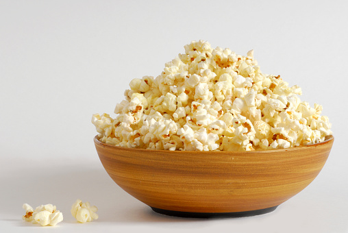 Bowl of popcorn with a white background