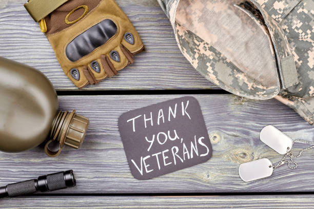 istock Set of military veteran's equipment, flat lay. 964262148