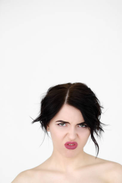 istock emotion face disgust woman hate disdain disrespect 964263908