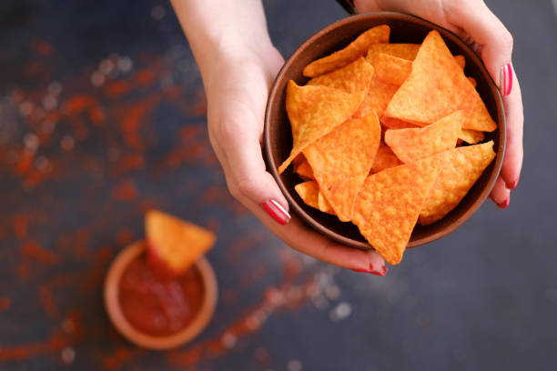 istock homemade tortilla nacho chips hold bowl hands 964266790