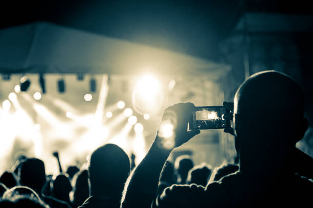 istock Live music crowd filming with smart phones 964267868