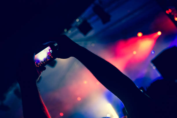 istock Live music crowd filming with smart phones 964267904