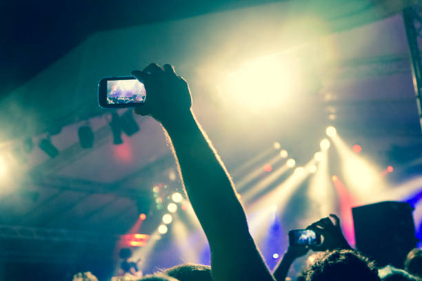 istock Live music crowd filming with smart phones 964268066