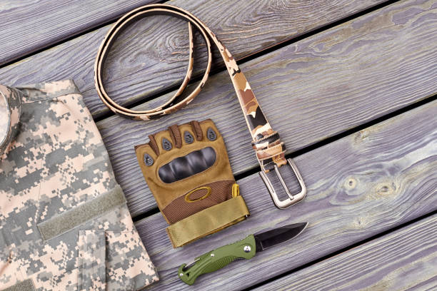 istock Twisted belt, glove and knife. 964268120