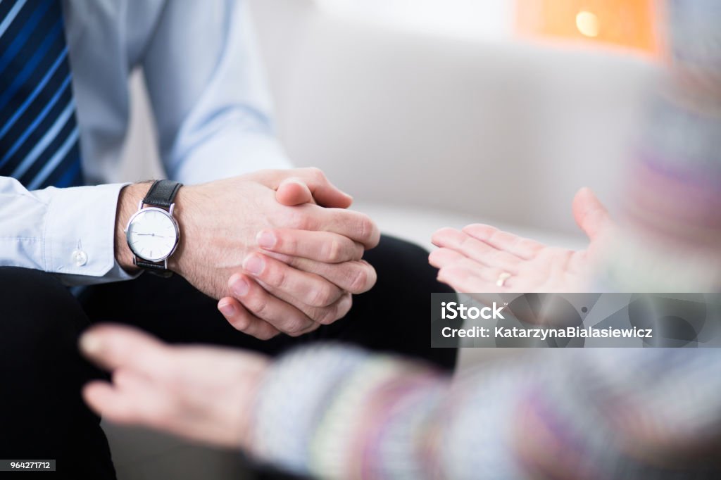 Male hands in grasp Close-up of male hands in grasp and female hands Psychotherapy Stock Photo