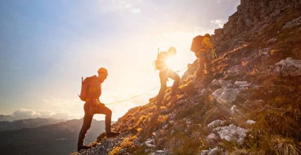 istock Mountaineers ascending mountain 964273728