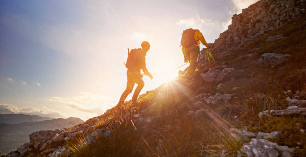 istock Mountaineers ascending mountain 964273746