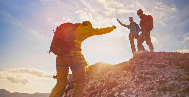 istock Mountaineers celebrating victory 964273752