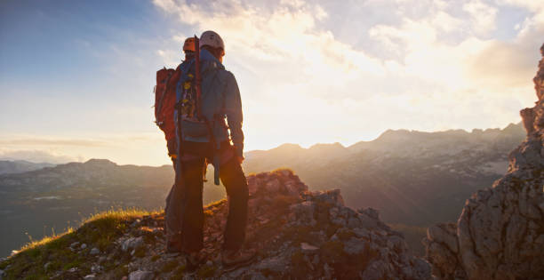 istock Mountaineers on top of mountain 964273762
