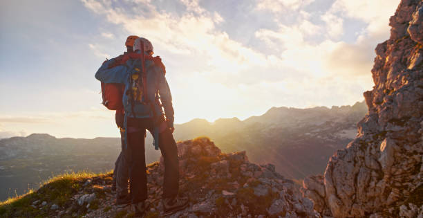 istock Mountaineers on top of mountain 964273766
