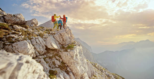 istock Mountaineers giving high-five 964273816