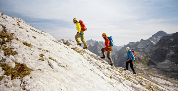 istock Mountaineers walking up on rocky mountain 964273862