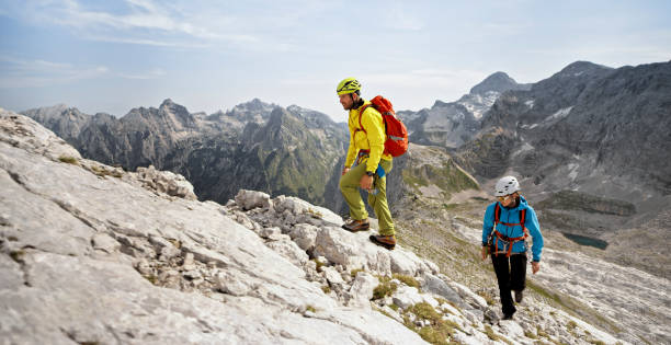istock Mountaineers walking up on rocky mountain 964273874