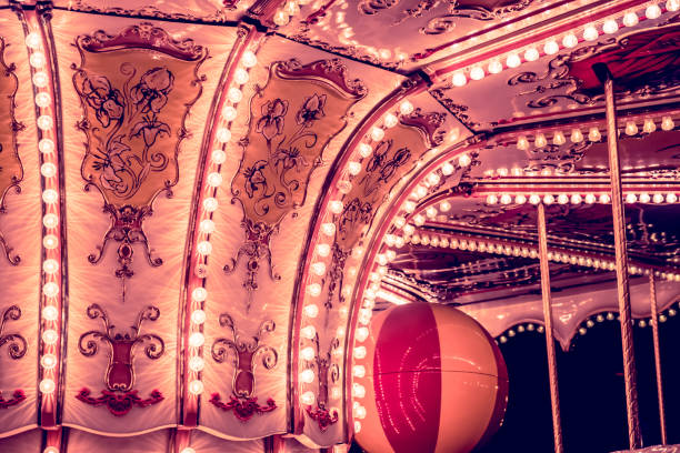 istock Children's Carousel at an amusement park in the evening and night illumination. 964282914