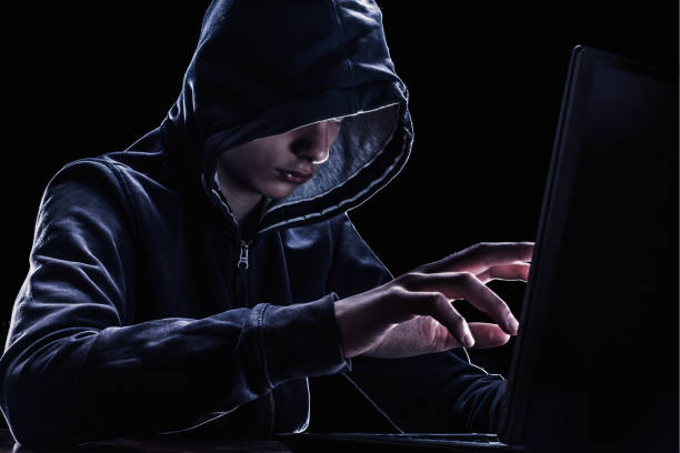 istock Violation of intellectual property rights concept. Hacker in a hood. 964283816