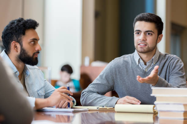 istock Male college student studying together 964284192