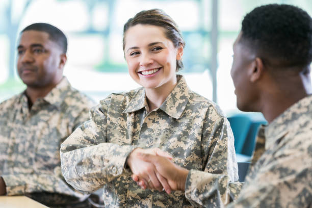istock Soldiers greet one another at military academy 964284390