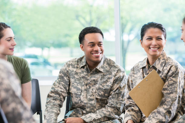 istock Group of soldiers in support group meeting 964284406