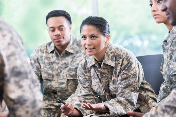 istock Female soldier discusses something during group therapy 964284408