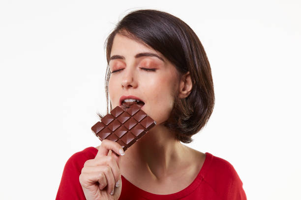 istock cute and beauty young woman and chocolate 964287164