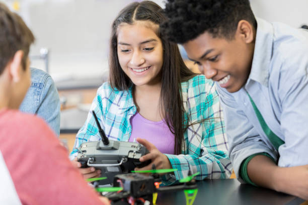istock Teenage students build drone 964287822