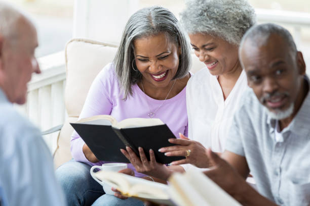 istock Group of seniors participate in Bible study 964288214